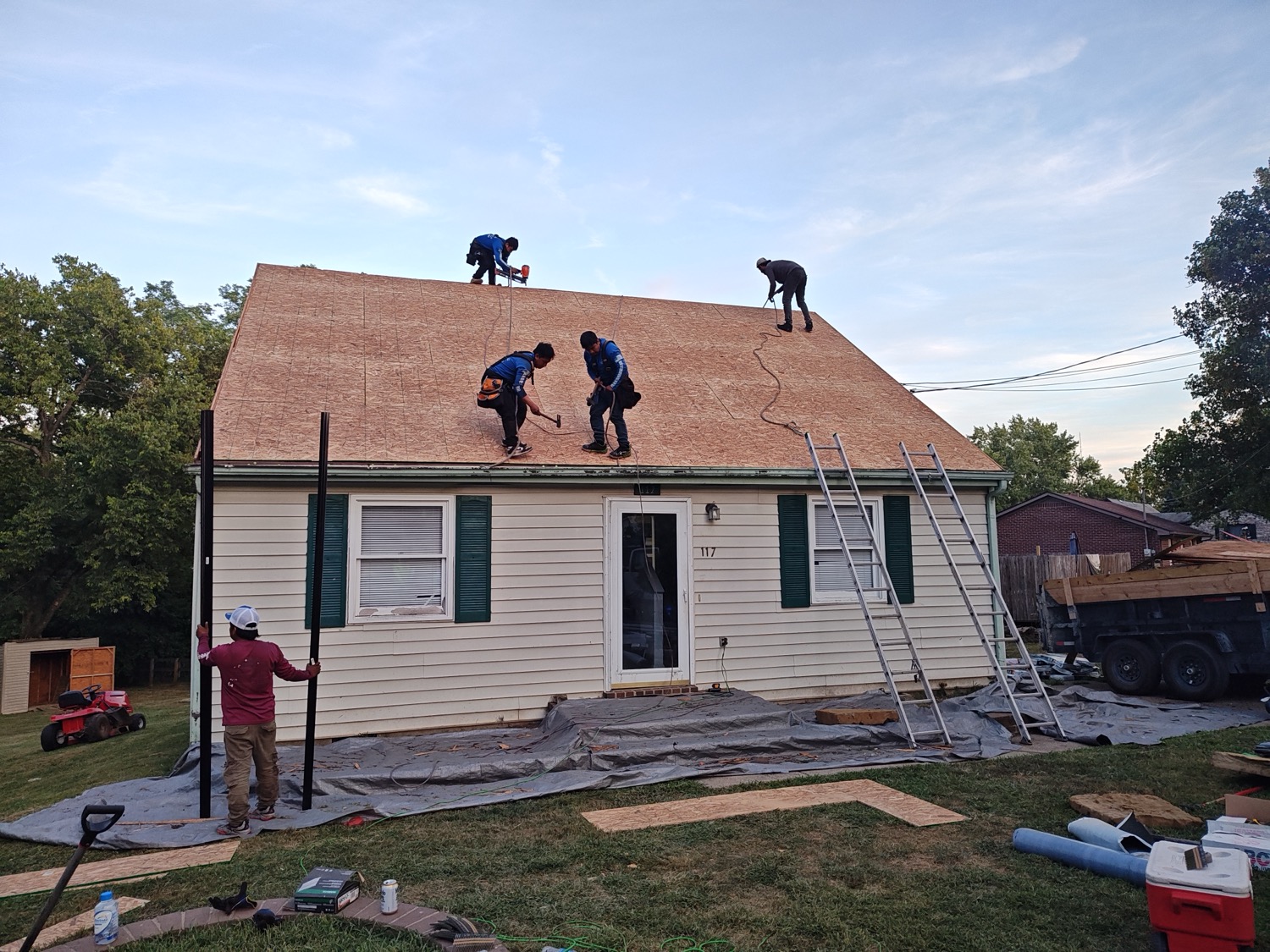 Completed home exterior with fresh siding